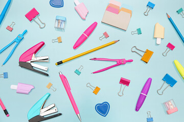 Many different stationery on blue background