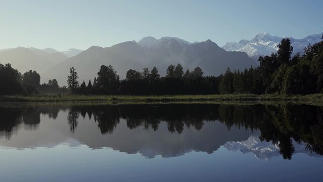 Reflection of the mountains in Lake Matheson. New Zealand, West Coast.