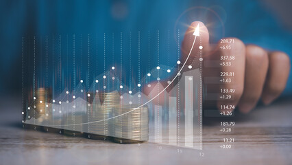 Businessman stacking coins with screen forex trading graph financial data. Goal business profit graph development. Stock market, financial growth report.