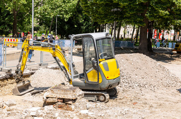 Crawler mini excavator on the construction site - obrazy, fototapety, plakaty