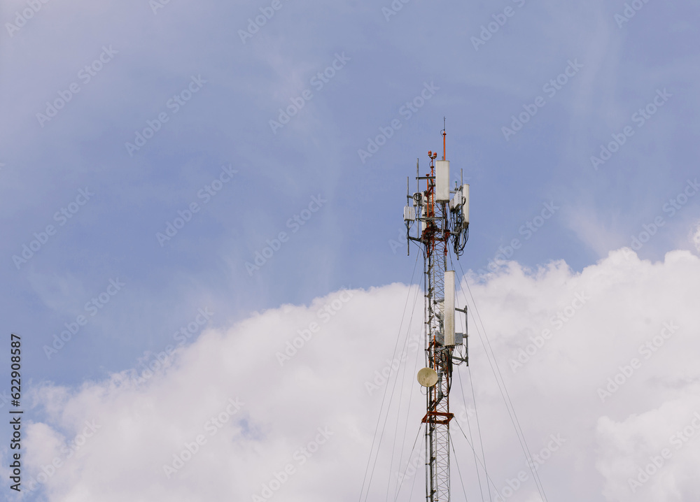 Wall mural cellular network towers or internet communications background as blue sky.