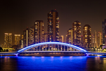 Tokyo night cityscape with blue bridge