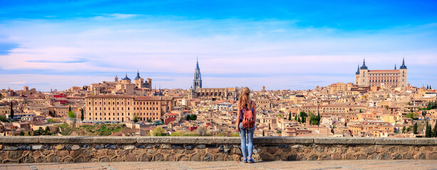 Woman standing in front og the skyline from Toledo- Spain - obrazy, fototapety, plakaty