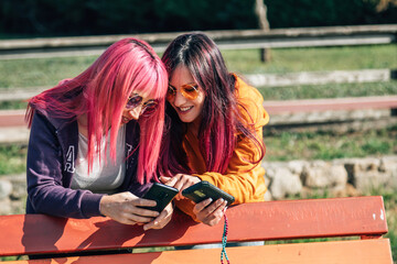 young women with mobile phone outside