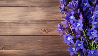 Bluebells on wooden background. Top view with copy space.