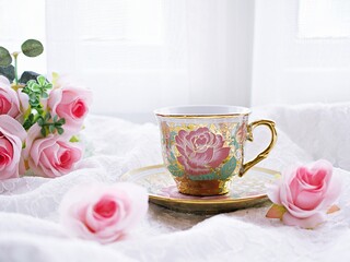 Antique cup of tea with pink rose on pink background ,Valentine's day romantic ,Mother's day ,pretty background or wallpaper ,Chinese traditional ,wedding card design ,coffee cup ,lovely love card 
