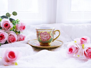 Antique cup of tea with pink rose on pink background ,Valentine's day romantic ,Mother's day ,pretty background or wallpaper ,Chinese traditional ,wedding card design ,coffee cup ,lovely love card 