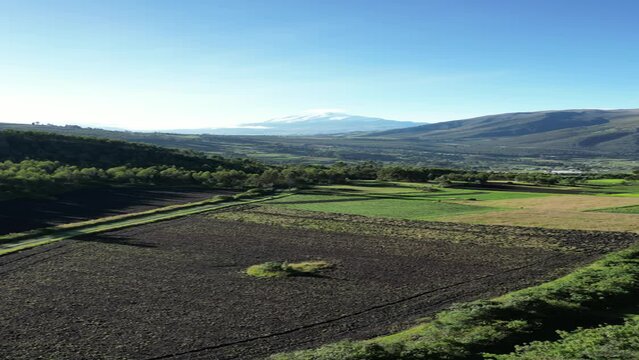 Volcano Cayambe drone view with mountains and forest