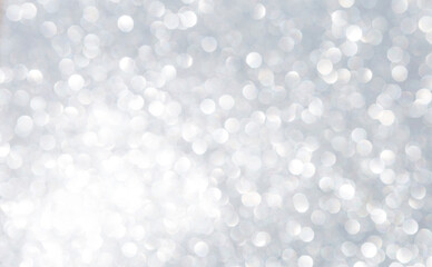 Abstract blurred shiny silver bokeh background, white bokeh on grey background