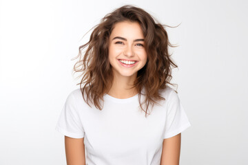 Fototapeta premium Close up of a young woman smiling and wearing a white t-shirt on a white background. Generative AI