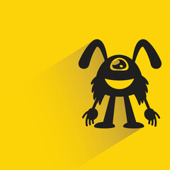 doodle monster with shadow on yellow background