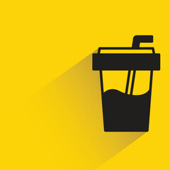 coffee cup with shadow on yellow background