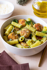 Pasta with chicken meatballs, basil and parmesan. Italian food.