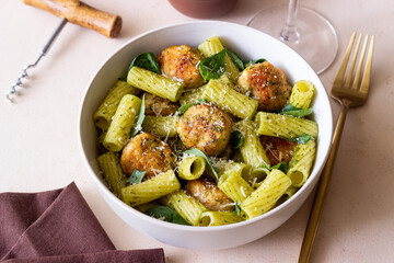 Pasta with chicken meatballs, basil and parmesan. Italian food.