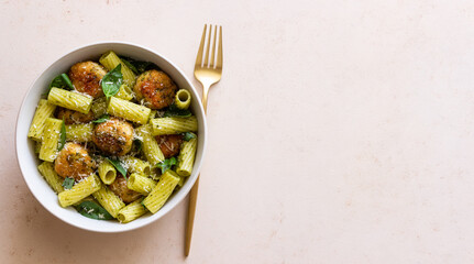 Pasta with chicken meatballs, basil and parmesan. Italian food.