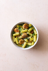Pasta with chicken meatballs, basil and parmesan. Italian food.