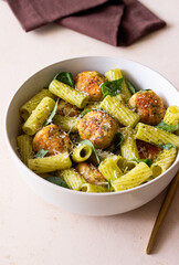 Pasta with chicken meatballs, basil and parmesan. Italian food.