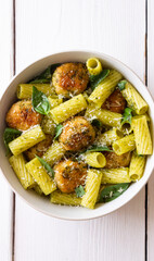 Pasta with chicken meatballs, basil and parmesan. Italian food.