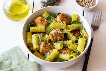 Pasta with chicken meatballs, basil and parmesan. Italian food.