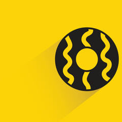 Obraz premium donut with shadow on yellow background