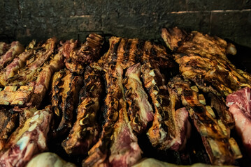 Argentinian grilled meat cooking - asado argentino - traditional argentinian food concept