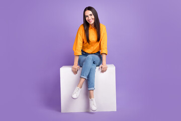 Full body size photo of sitting podium young woman wear trendy clothes advertisement posing model isolated on purple color background