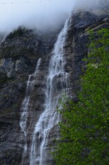 Low angle view of beautiful waterfall in mountains