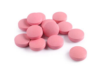 Obraz na płótnie Canvas Pile of pink pills on white background