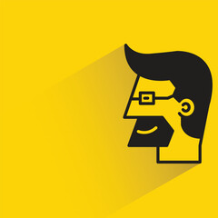 beard man face with shadow on yellow background