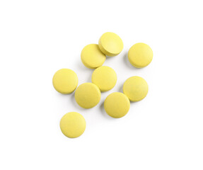 Many yellow pills isolated on white, top view