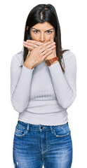 Beautiful brunette woman wearing casual clothes shocked covering mouth with hands for mistake. secret concept.
