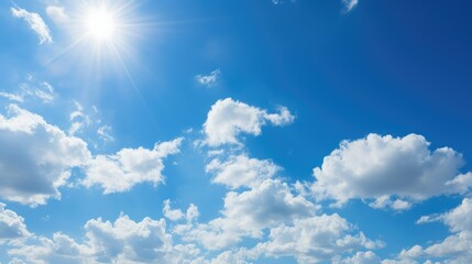 Naklejka na ściany i meble A photo of a blue sky with white clouds and a shining sun