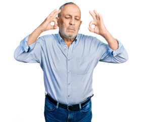 Senior man with grey hair and beard wearing casual blue shirt relax and smiling with eyes closed doing meditation gesture with fingers. yoga concept.