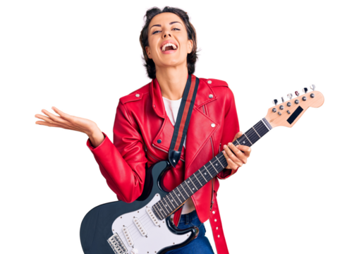 Young beautiful woman playing electric guitar celebrating victory with happy smile and winner expression with raised hands - Powered by Adobe