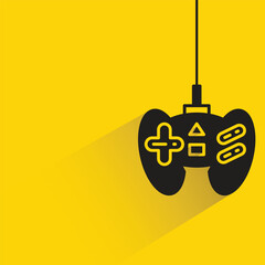 gamepad and joystick with shadow on yellow background