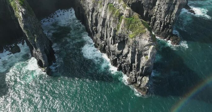 Cintr&atilde;o cliffs cliffs overhanging the ocean on the island of Sao Miguel in the Azores