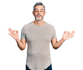 Middle age hispanic with grey hair wearing casual grey t shirt relax and smiling with eyes closed doing meditation gesture with fingers. yoga concept.