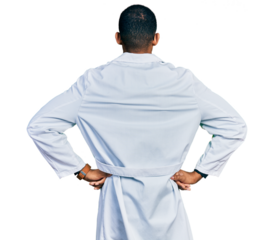 Young african american man wearing doctor uniform and stethoscope standing backwards looking away with arms on body