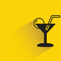 cocktail glass with shadow on yellow background