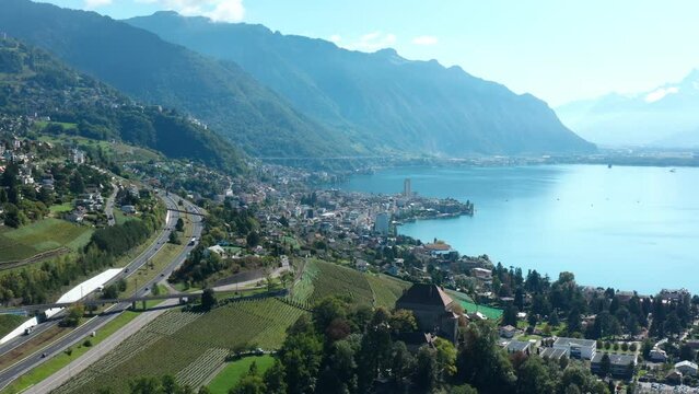 Aerial flight over Montreux City. View to Lake of Geneva and Swiss mountains. Alps Switzerland.