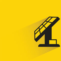 solar panel with shadow on yellow background