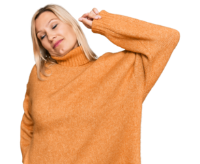 Middle age caucasian woman wearing casual winter sweater stretching back, tired and relaxed, sleepy and yawning for early morning