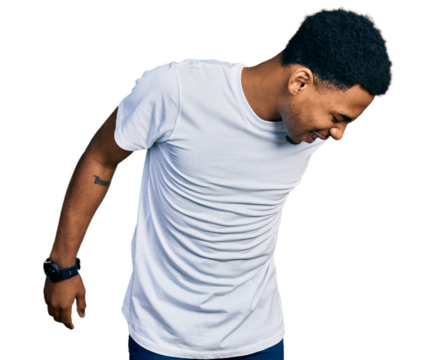 Young african american man wearing casual white t shirt suffering of backache, touching back with hand, muscular pain