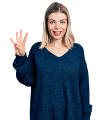 Young blonde woman wearing casual sweater showing and pointing up with fingers number four while smiling confident and happy.