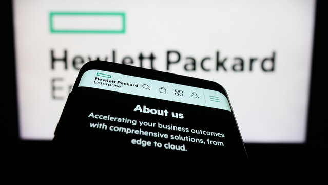 Stuttgart, Germany - 07-02-2023: Smartphone with website of Hewlett Packard Enterprise Company (HPE) on screen in front of business logo. Focus on top-left of phone display.