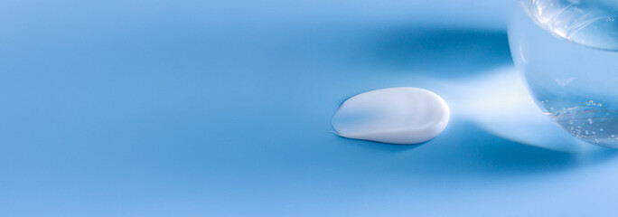 banner cosmetic smears cream texture on pastel blue background