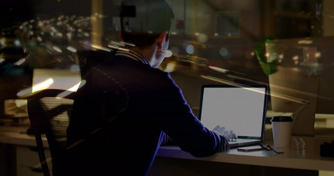 Animation of asian businessman using computer over data processing and cityscape