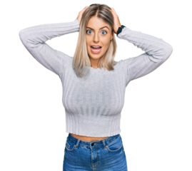 Beautiful blonde woman wearing casual clothes crazy and scared with hands on head, afraid and surprised of shock with open mouth
