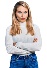 Fototapeta premium Young blonde woman with arms crossed gesture depressed and worry for distress, crying angry and afraid. sad expression.