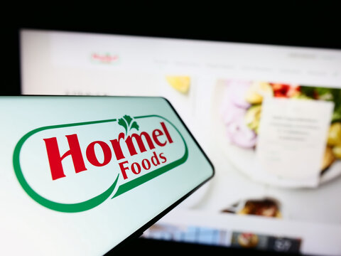 Stuttgart, Germany - 07-02-2023: Smartphone with logo of American food company Hormel Foods Corporation on screen in front of website. Focus on center-left of phone display.